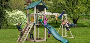 Cubby's Fort vinyl swing set with children playing