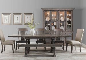 Baldwin Collection Dining room table and chairs with a bench and hutch in a modern grey dining room.