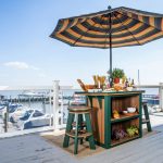 Poly bar and bar stools on waterfront deck