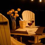 Amish handcrafted fanback chairs and conversation table on deck at night