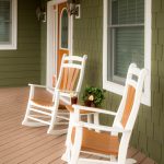 2 White poly porch rockers on a porch