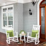 Amish crafted white poly rockers and accent table on front porch.