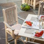 Aerial view of poly dining furniture on flagstone patio.