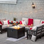 Poly outdoor furniture around a fire pit on a hardscape patio.