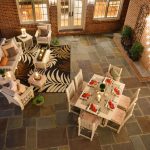Poly dining and patio furniture by Finch on patio at dusk