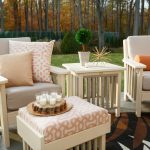Amish crafted poly deep seating patio furniture on flagstone patio with autumn backdrop