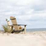 Amish crafted poly outdoor furniture - Adirondack chairs on sandy beach.