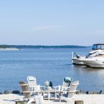 4 Adirondack chairs and coffee table on oceanfront dock.