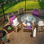 Poly outdoor dining set on paver patio