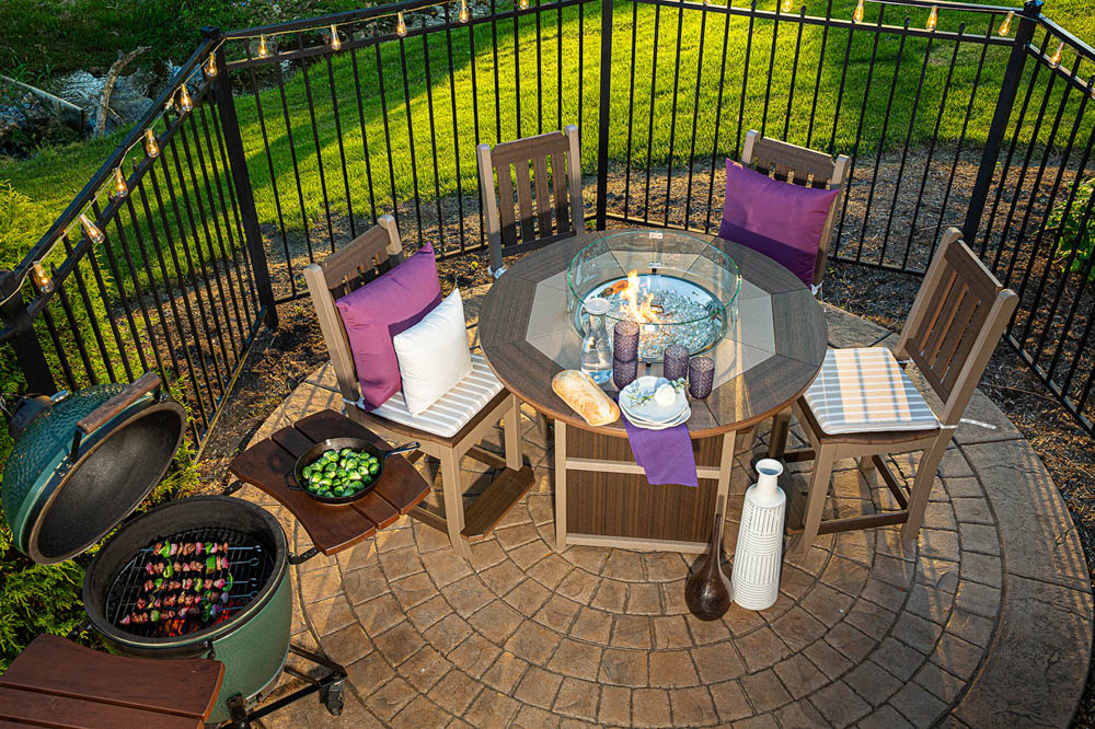 Poly outdoor dining set on paver patio