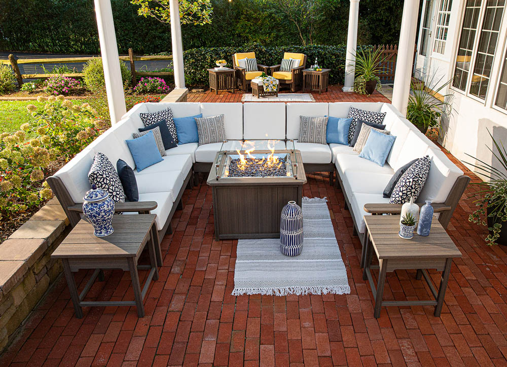 Outdoor furniture with deep seating around a gas fire pit