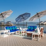 Amish built poly patio furniture on boardwalk by boat dock