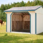 10' x 12' run in horse shed finished in white with blue trim.