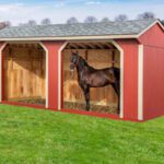 10' x 20' horse run in shed in red and white.