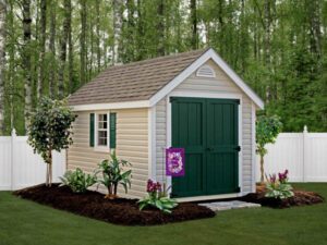 Storage shed with vinyl siding in backyard