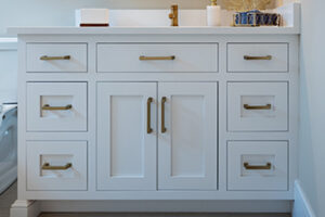 Custom white bathroom vanity with inset doors and drawers