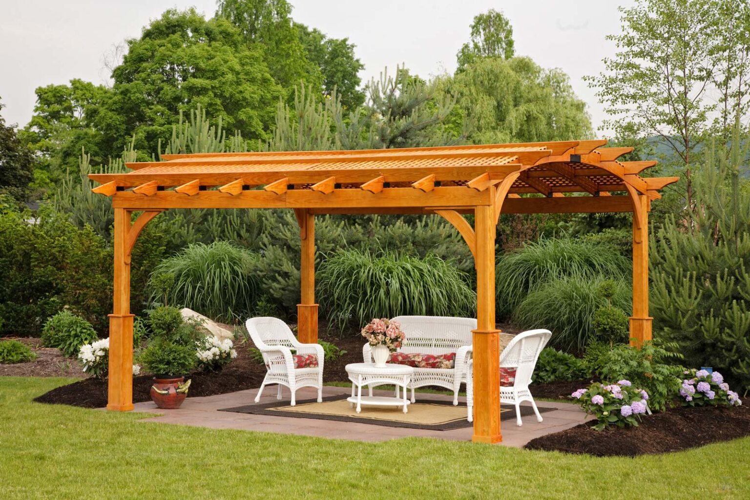 Cozy arch wood pergola and white outdoor furniture