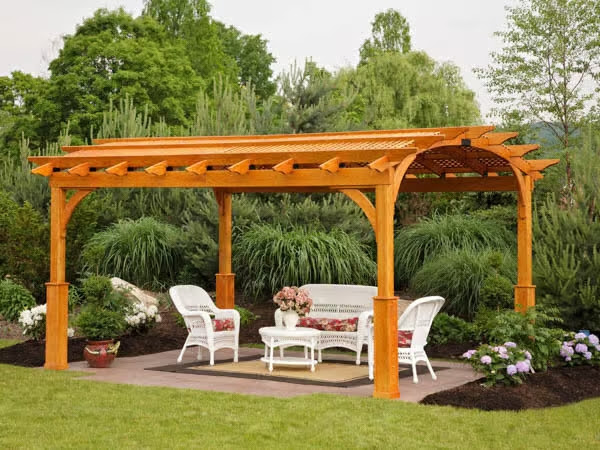 Amish crafted wood pergola with white outdoor furniture