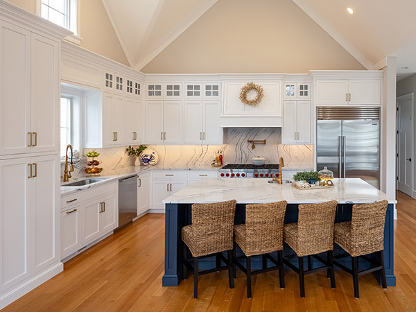 modern white custom kitchen cabinets with blue Island