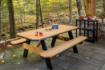 finch poly picnic table on patio in the woods.